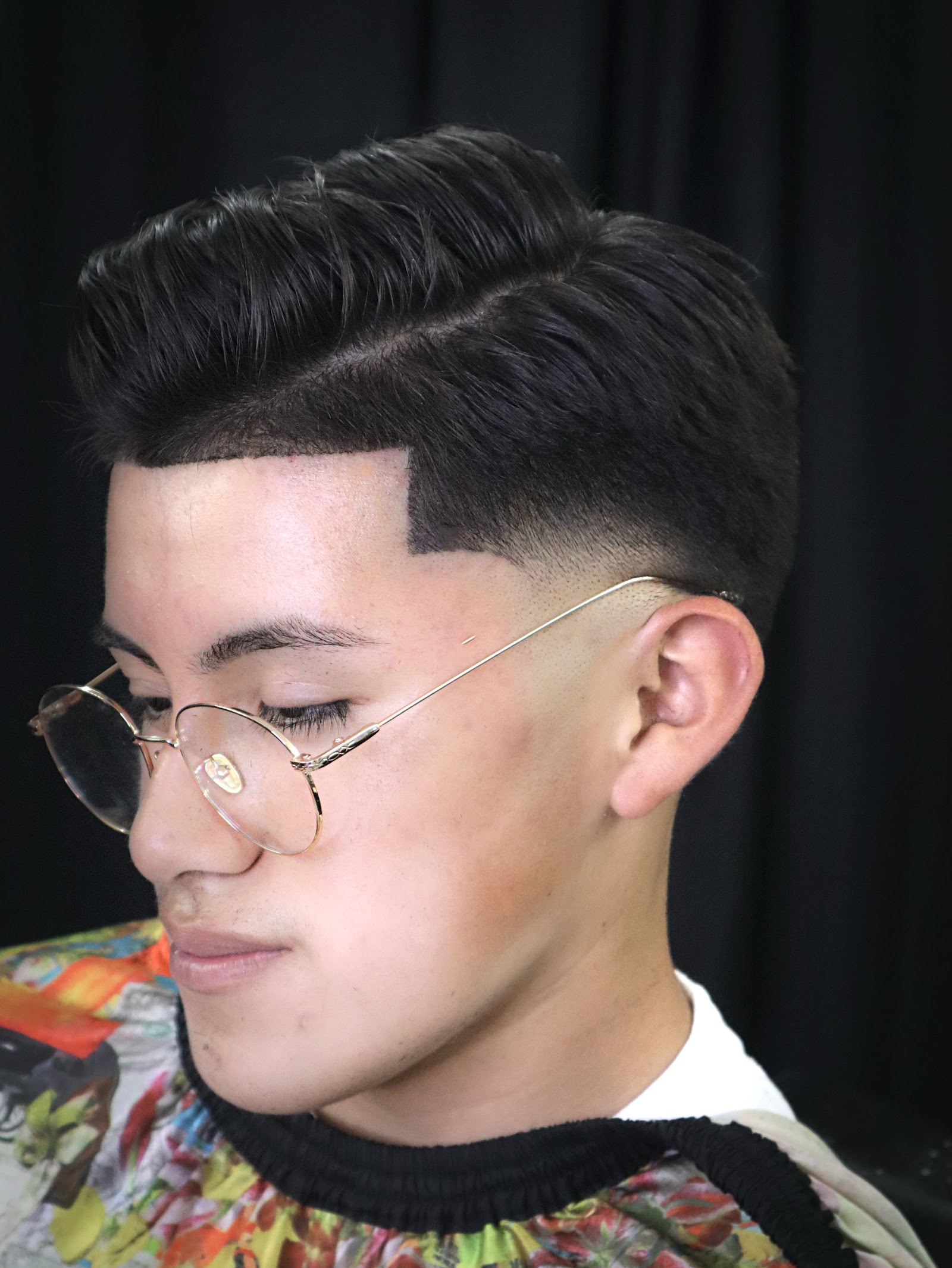 Clean pompadour with a sharp line-up and skin fade
